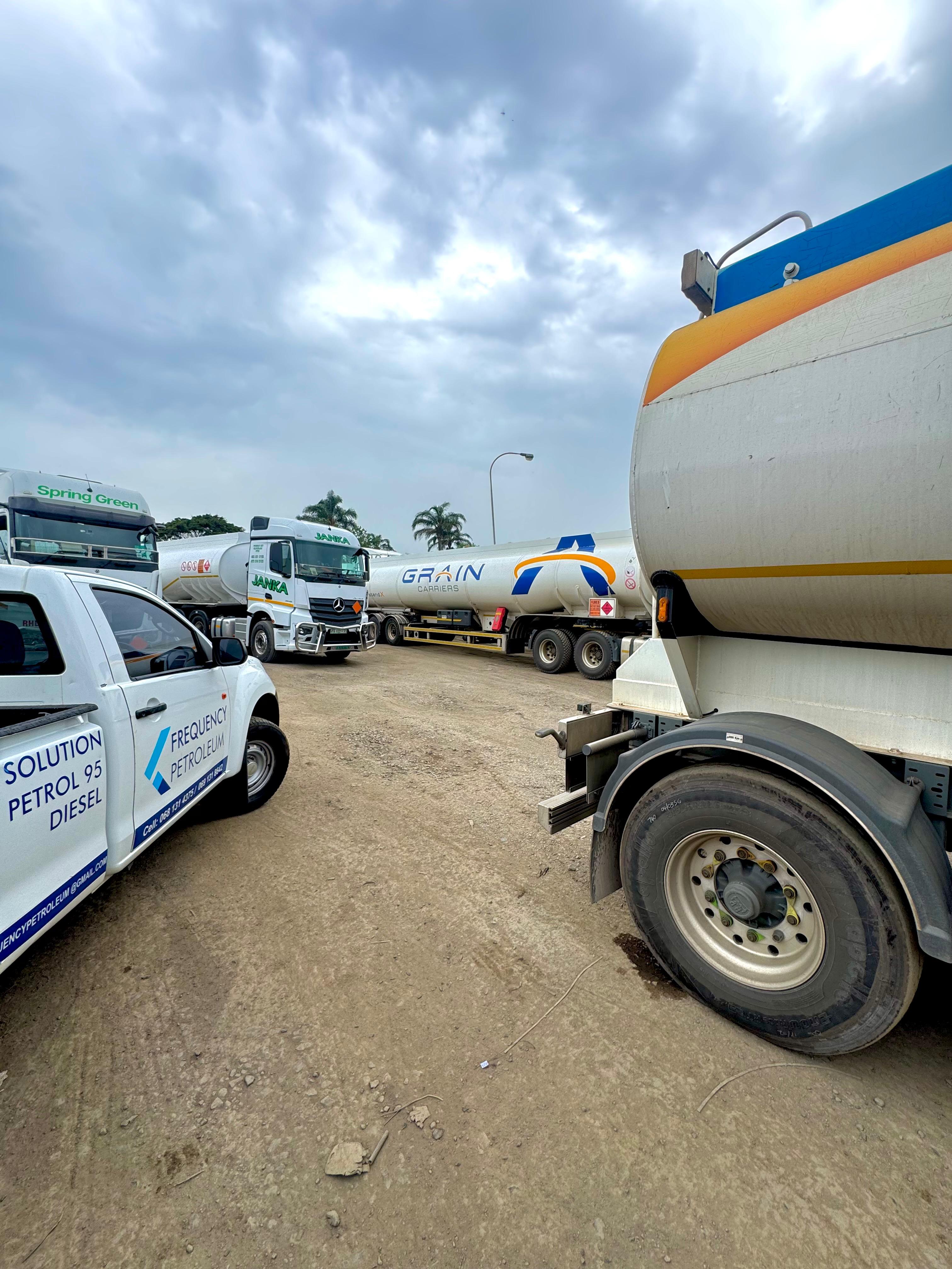 Frequency Petroleum branded vehicle alongside tanker trucks